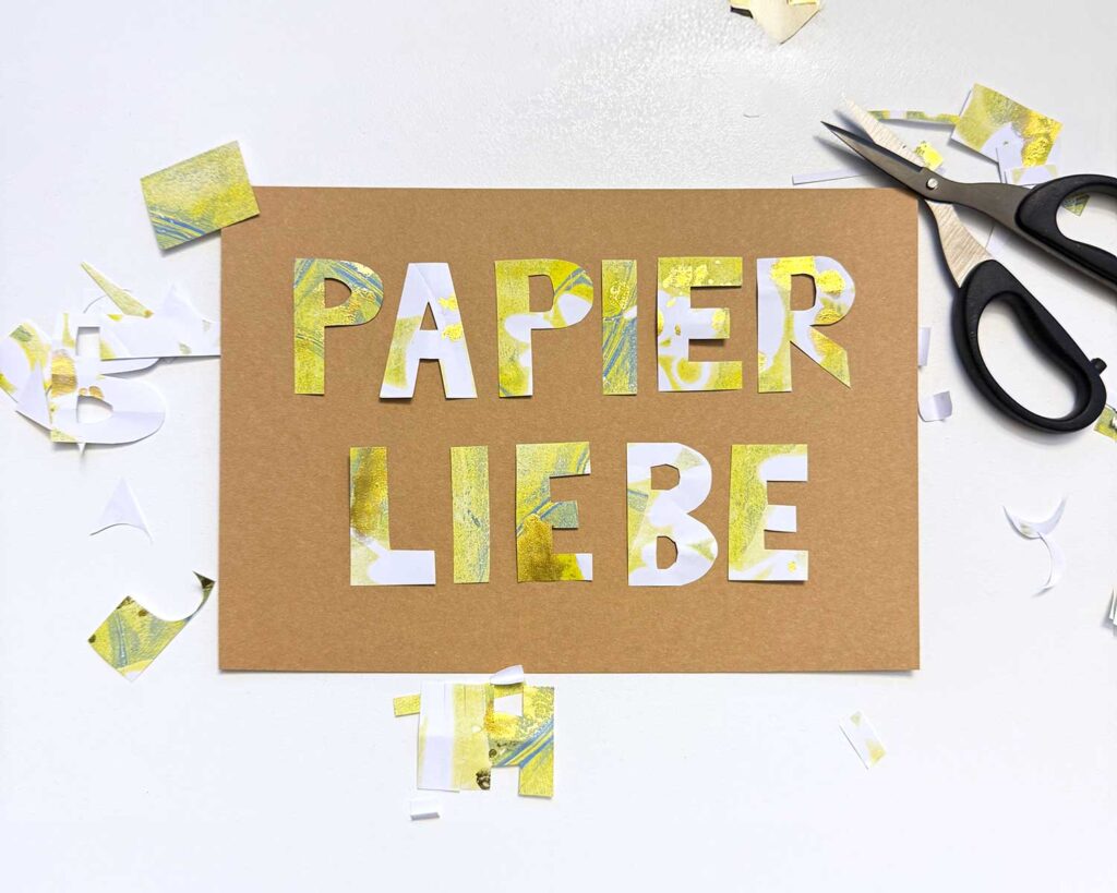 Paper Cut Collage mit Buchstaben